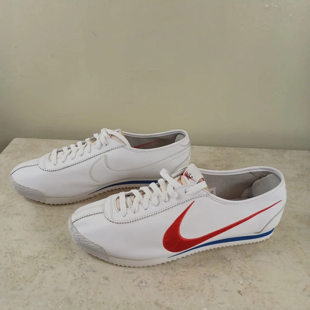 Nike White Sneakers with Red Swoosh and Blue Outsole Trim